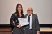 Dr. Nagib Callaos, General Chair, giving Ms. Jessica Ulmer the best paper award certificate of the session "Applications of Informatics and Cybernetics in Science and Engineering I." The title of the awarded paper is "Generic Integration of VR and AR in Product Lifecycles Based on CAD Models."